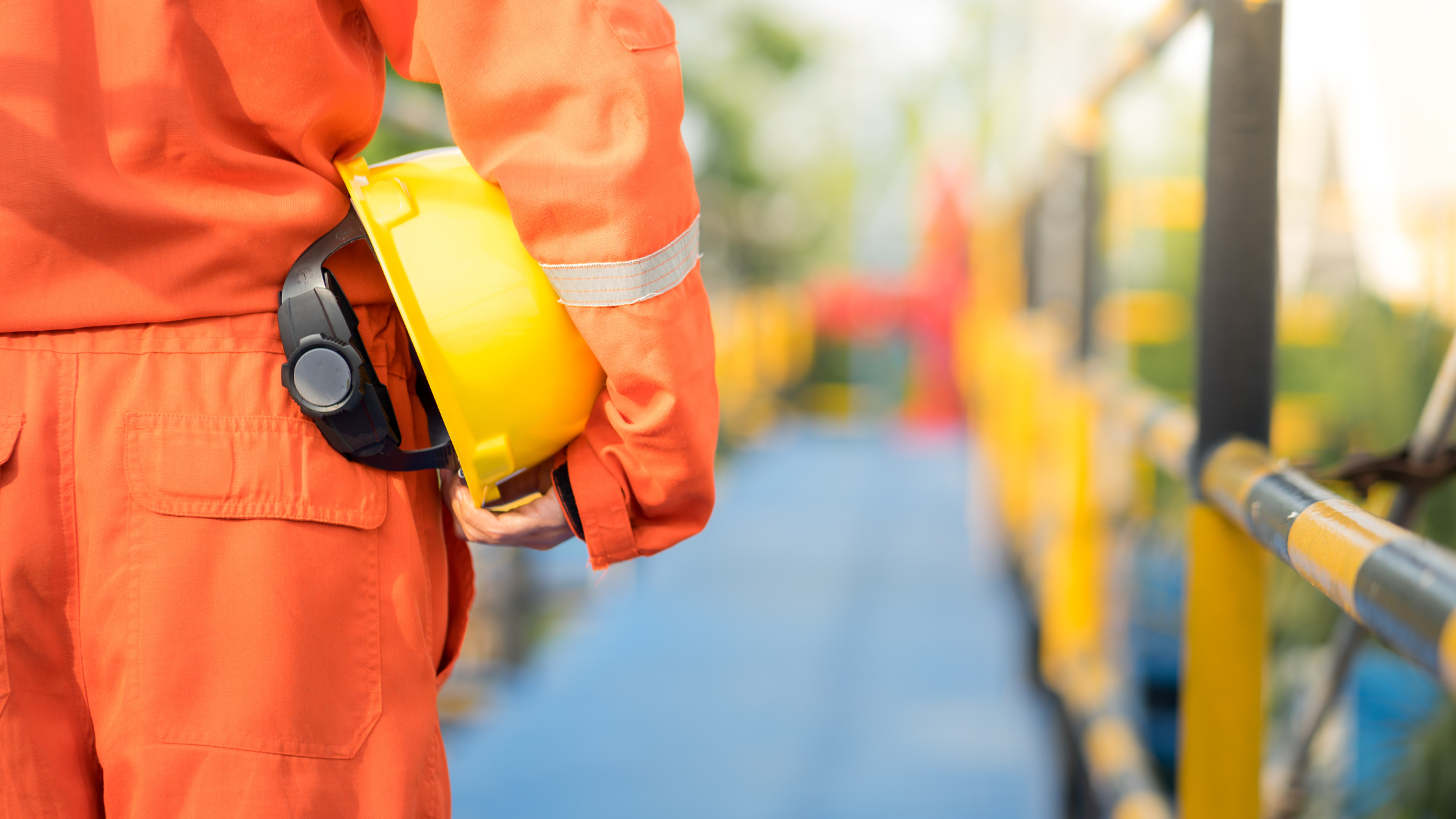 Construction worker with hard hat on a jobsite.