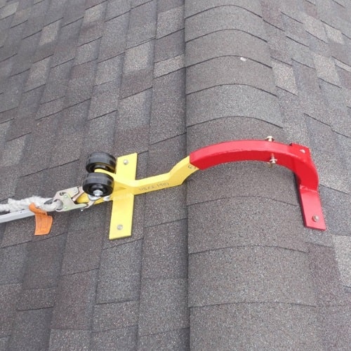 A RidgePro peak anchor being used on a shingle roof.
