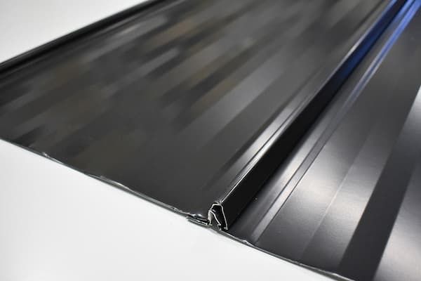 Profile image of the GNMC 1-inch Nailstrip panel featuring an integrated fastener flange for easy installation; image courtesy of www.GNMCUSA.com.