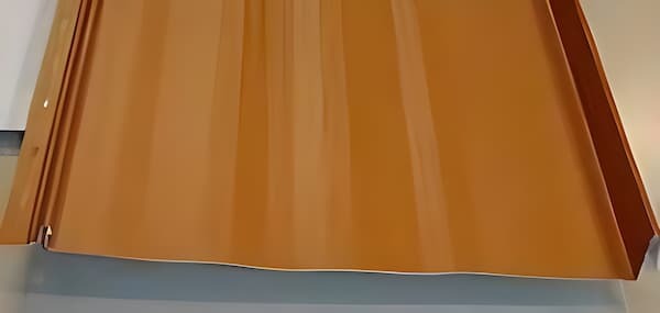 Goldin Metals Nail Strip standing seam metal roofing panel profile with pre-punched flange. Image courtesy of www.GoldinMetals.com