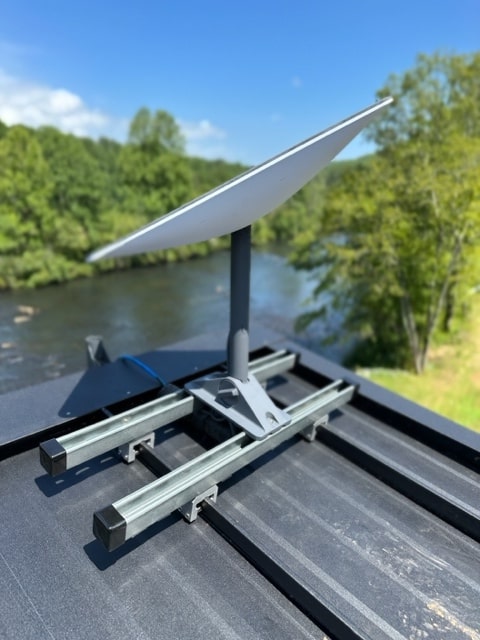 SataMount kit used to mount a satellite dish to a standing seam metal roof.