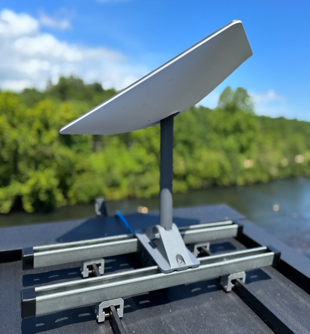 Standing seam roof with a satellite dish installed using a SataMount kit.