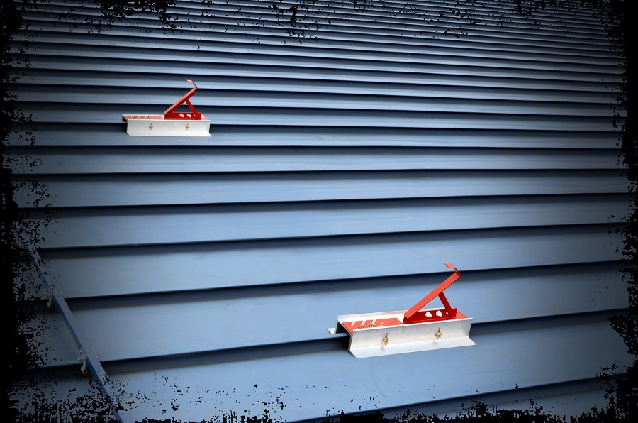 SSRA2 Roof Jacks installed on a standing seam roof for walkboard mounting.