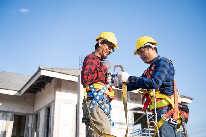 Construction worker using fall protection